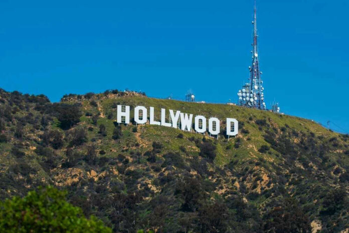 shutterstock_2379716613.jpg Hollywood sign on a green mountain hillside.