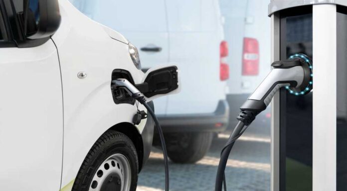 shutterstock_2171607597.jpg Electric vehicle connected to a charging station