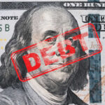 Hundred dollar bill with red debt stamp