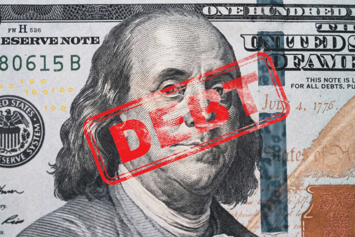 Hundred dollar bill with red debt stamp