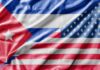 Close-up of the Cuban and American flags displayed together