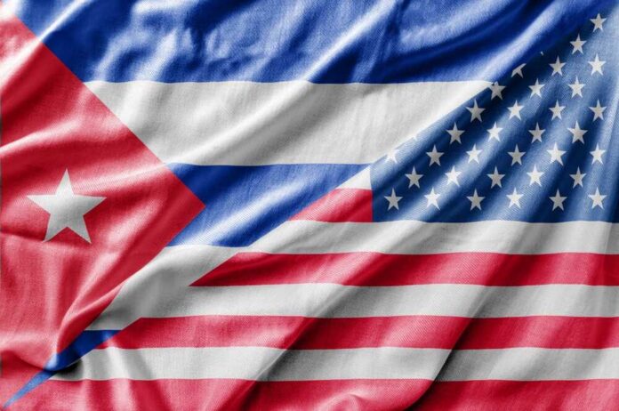 Close-up of the Cuban and American flags displayed together