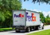 FedEx freight truck driving down a suburban street