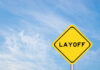 Yellow warning sign displaying the word 'LAYOFF'