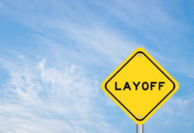 Yellow warning sign displaying the word 'LAYOFF'