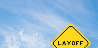 Yellow warning sign displaying the word 'LAYOFF'