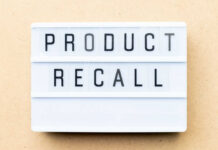 Lightbox sign with the words product recall on a beige background