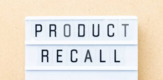 Lightbox sign with the words product recall on a beige background