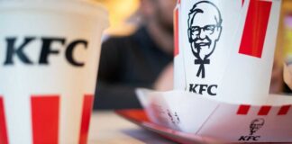 Exterior view of a KFC restaurant with its iconic logo